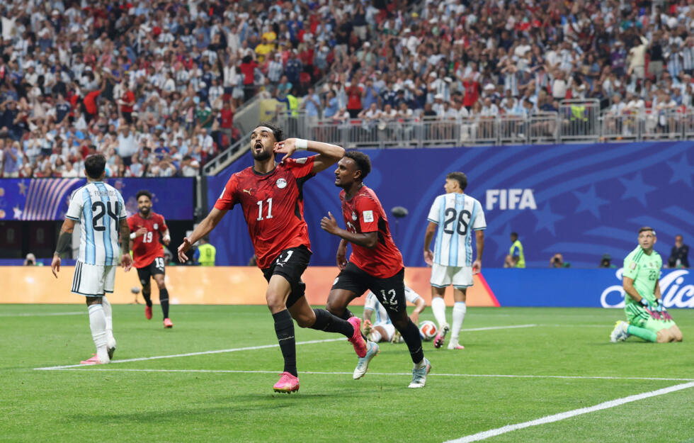 Egypt national football team forward Mostafa Zico (#11) celebrating his goal against Argentina alongside teammate Ahmed Nabil Koka (#12) during their FIFA World Cup 2026 Round of 16 match at Atlanta Stadium. Image used for Sportxparte news.