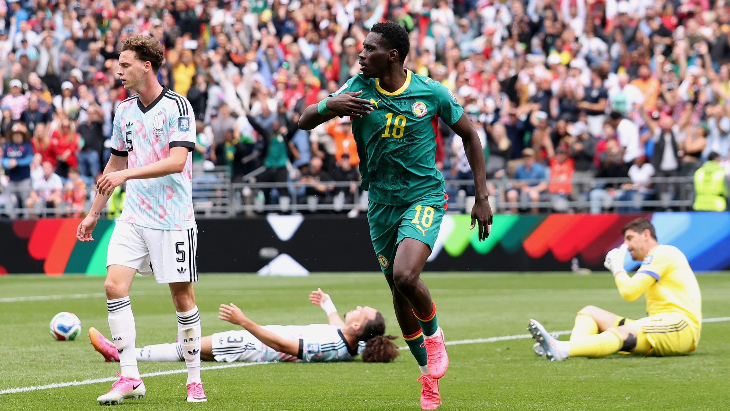 Senegalese winger Ismaïla Sarr (#18) is celebrating after scoring his side's second goal against Belgium during their high-stakes 2026 FIFA World Cup Round of 32 knockout match. Image used for Sportxparte news.