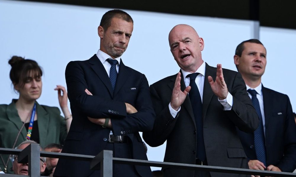 Gianni Infantino, the President of FIFA, speaking while Aleksander Čeferin, the President of UEFA, looks on with his arms crossed. Image used for Sportxparte news.