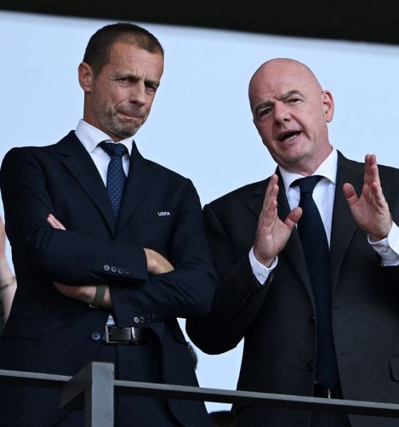 Gianni Infantino, the President of FIFA, speaking while Aleksander Čeferin, the President of UEFA, looks on with his arms crossed. Image used for Sportxparte news.