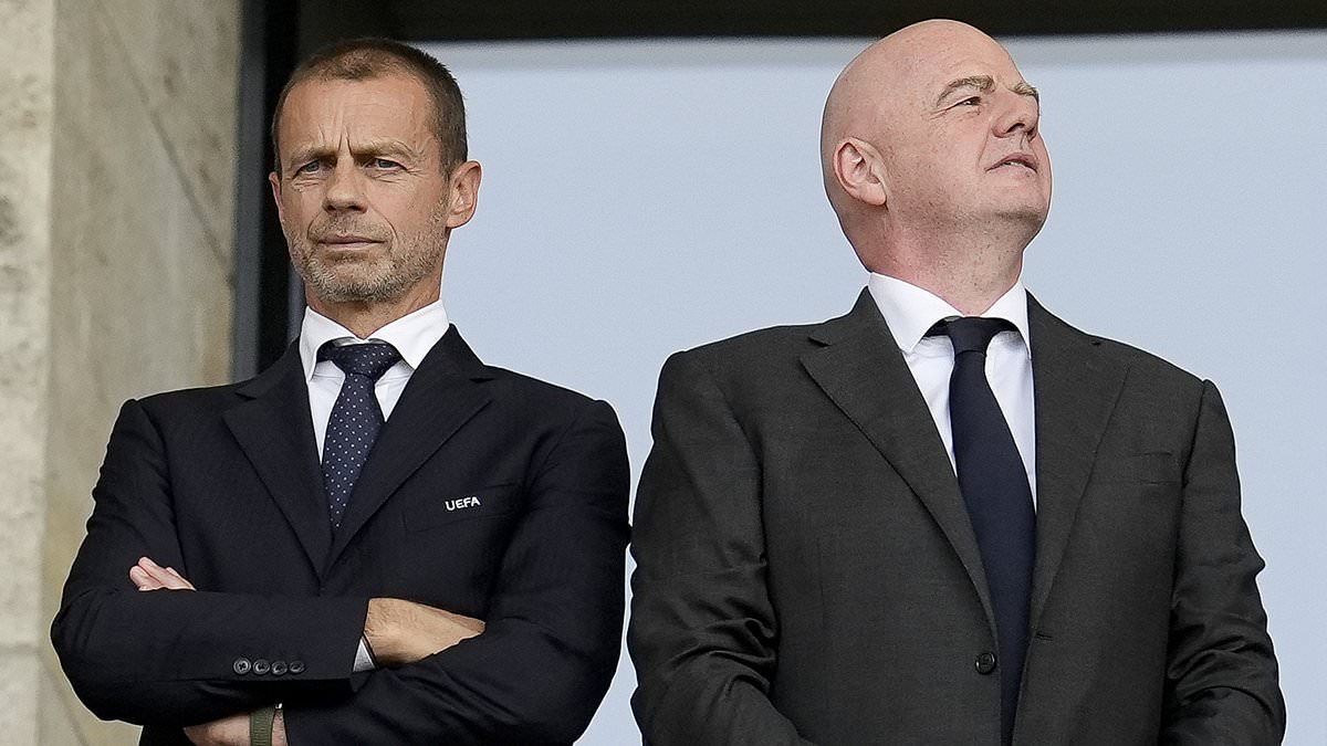 UEFA President Aleksander Ceferin and FIFA President Gianni Infantino standing side-by-side in suits during a football match, illustrating the ongoing executive dispute and UEFA boycott. Image used for Sportxparte news.