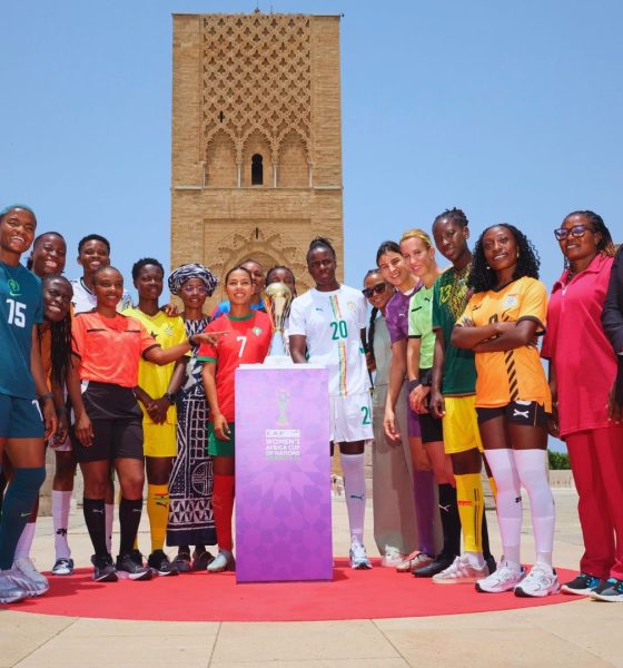 Female football players from various national teams posing with the new TotalEnergies CAF Women's Africa Cup of Nations trophy at the Hassan Tower in Rabat, Morocco. Image used for Sportxparte news.