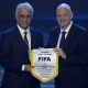 FIFA President Gianni Infantino and AFC President Sheikh Salman bin Ebrahim Al Khalifa holding a commemorative FIFA pennant banner at the AFC Annual Awards ceremony in Seoul. Image used for Sportxparte news.