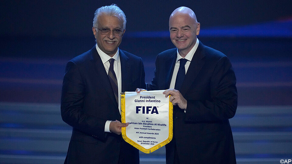 FIFA President Gianni Infantino and AFC President Sheikh Salman bin Ebrahim Al Khalifa holding a commemorative FIFA pennant banner at the AFC Annual Awards ceremony in Seoul. Image used for Sportxparte news.