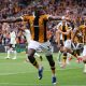 Newly promoted Hull City achieved a historic 2-0 victory over Manchester United in their Premier League opening match at the MKM Stadium on August 22, 2026. First-half goals from Semi Ajayi and Nobel Mendy sealed the shock win. Image used for Sportxparte news.