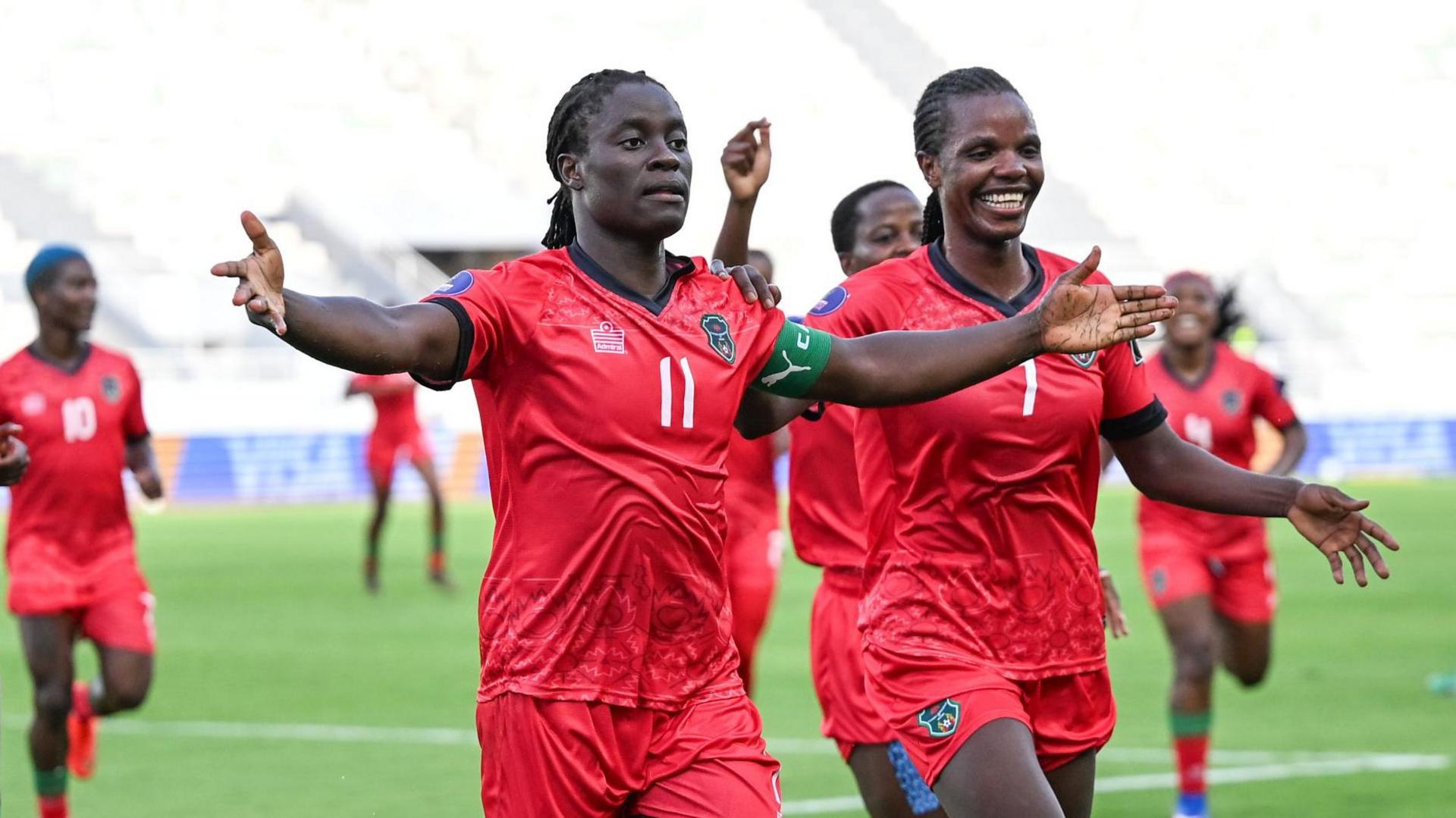 Malawi's national women's football team stars, sisters Tabitha and Temwa Chawinga, celebrate a goal during their remarkable debut run at the Women's Africa Cup of Nations (WAFCON). Image used for Sportxparte news.