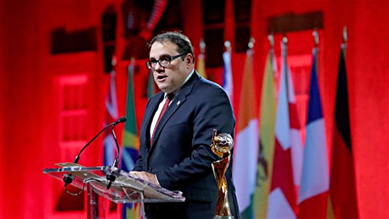 The man speaking at the podium is Victor Montagliani, the president of CONCACAF and a Vice President of FIFA. Image used for Sportxparte news.
