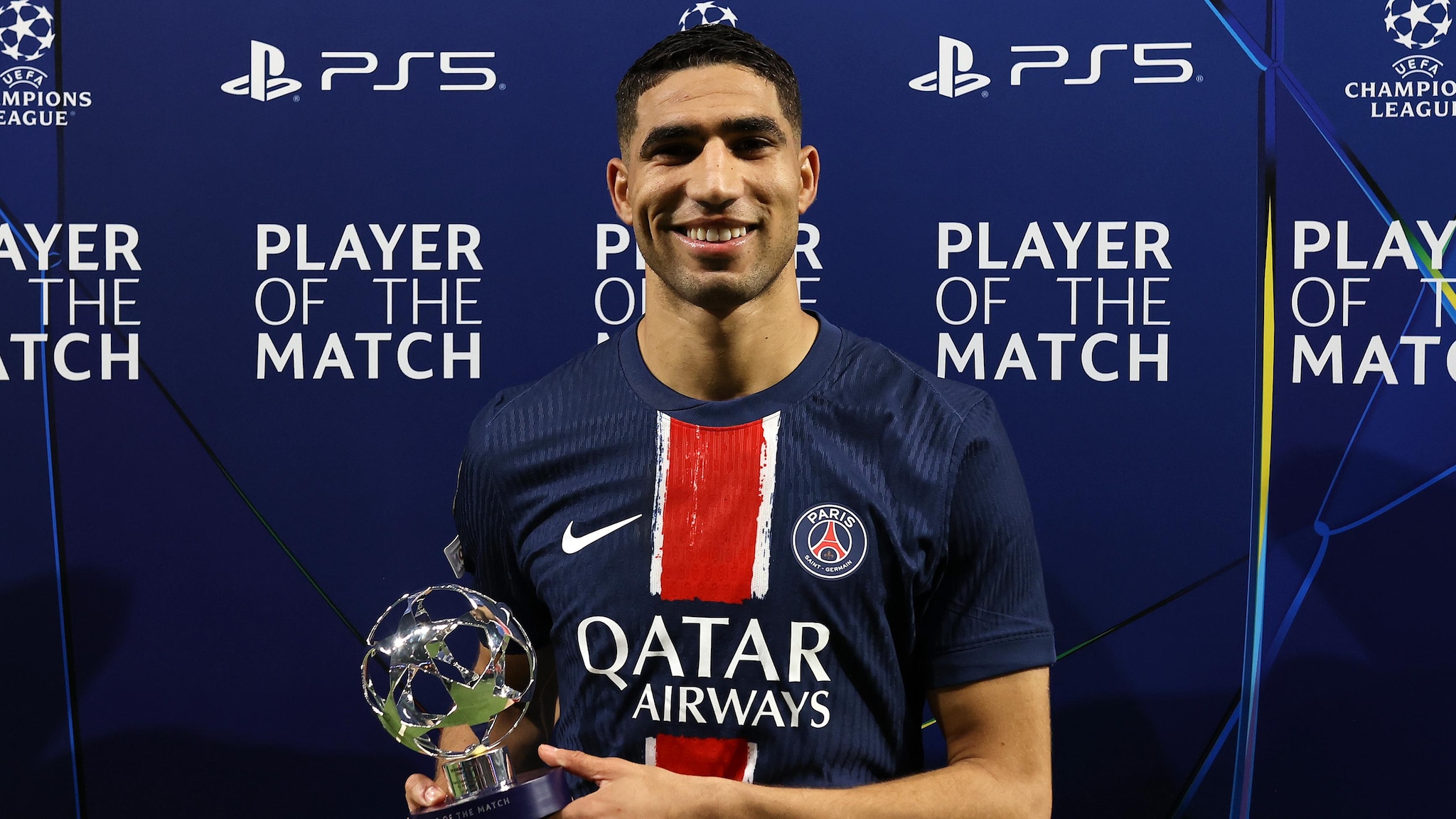 Paris Saint-Germain captain Achraf Hakimi is celebrating his UEFA Champions League Player of the Match award after a dominant performance. Image used for Sportxparte news.