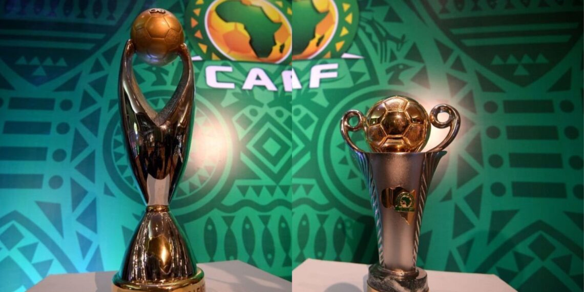 The golden CAF Champions League trophy and the CAF Confederation Cup trophy displayed side-by-side against a green Confederation of African Football background. Image used for Sportxparte news.
