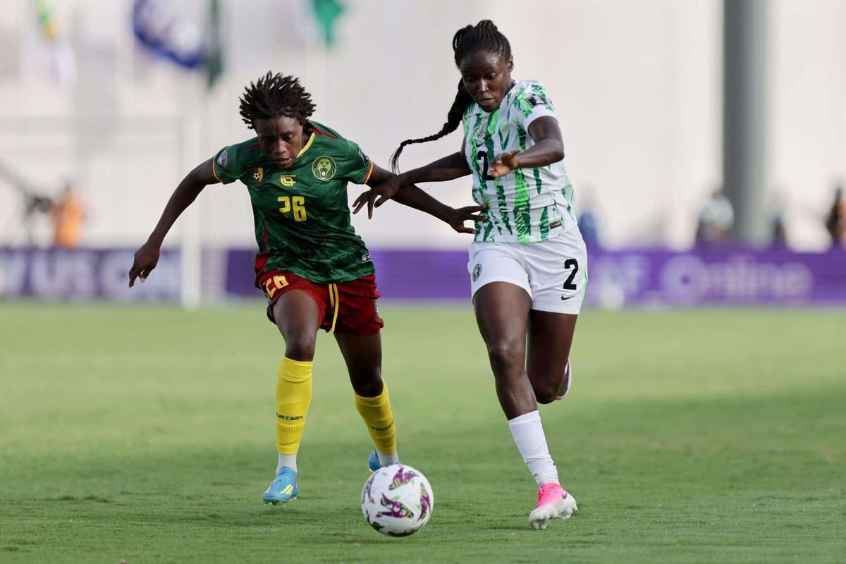 Cameroon vs. Nigeria quarter-final during the 2026 Women's Africa Cup of Nations (WAFCON). The photo features Nigerian captain Rasheedat Ajibade (right, wearing #2) contesting for possession against Cameroon defender Mariane Ines Maague (left, wearing #26). Image used for Sportxparte news.