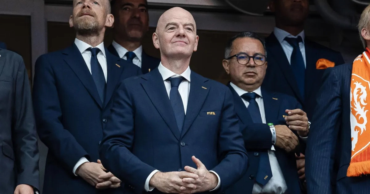 FIFA President Gianni Infantino is wearing a dark blue suit with a small FIFA logo pin. Image used for Sportxparte news.