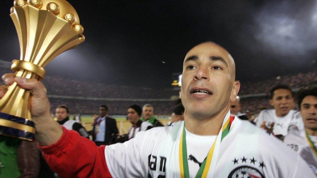 Egypt captain Hossam Hassan holding the Africa Cup of Nations trophy after winning the 2006 AFCON tournament in Cairo. Image used for Sportxparte news.