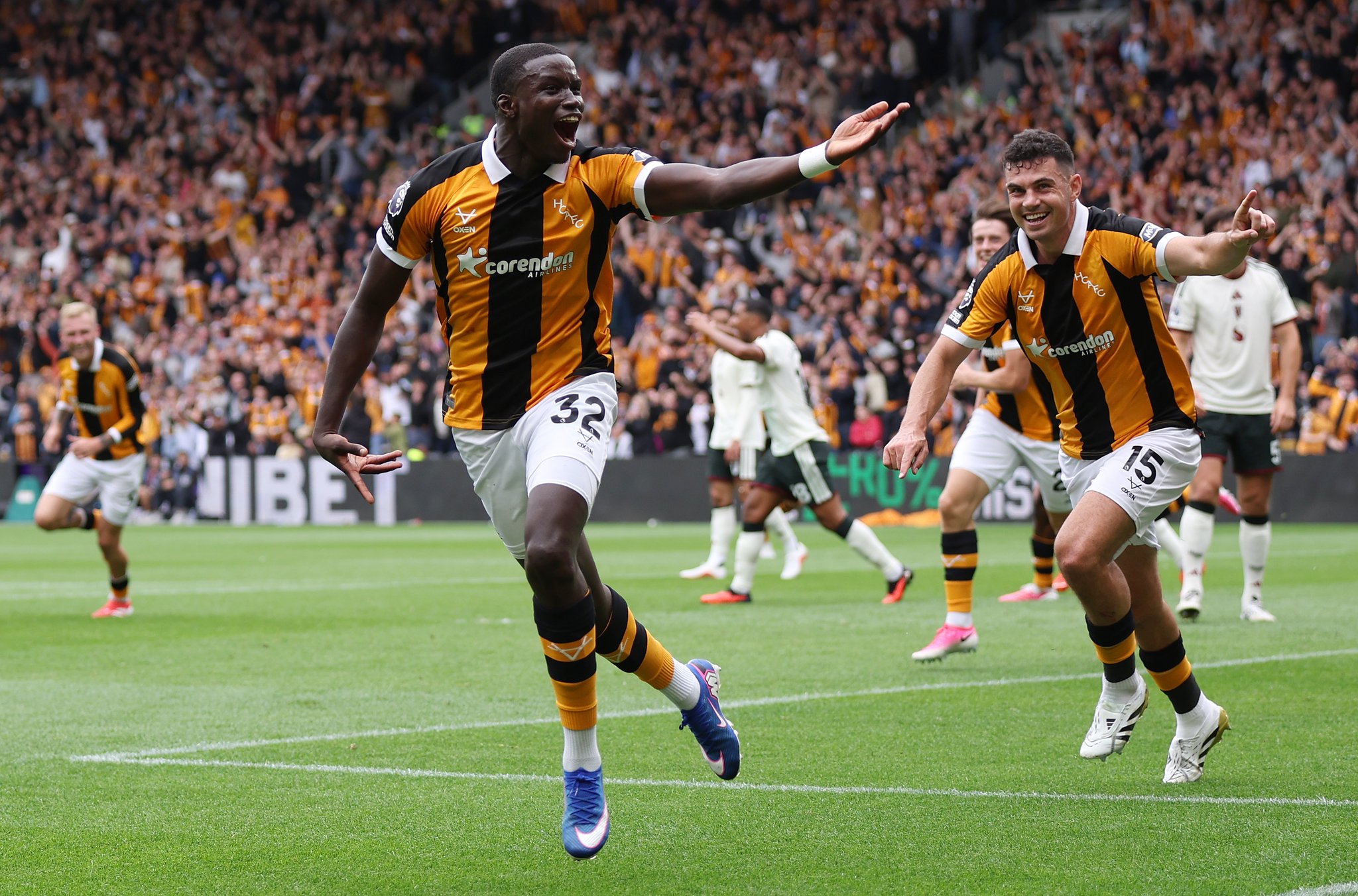 Hull City player Nobel Mendy celebrating after scoring his team's second goal against Manchester United. The match took place on August 22, 2026, at the MKM Stadium, marking Hull City's return to the Premier League. Image used for Sportxparte news.