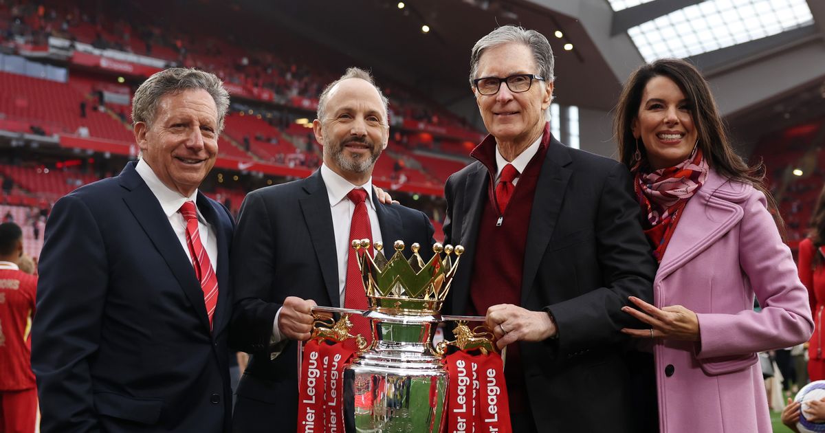 Tom Werner, Billy Hogan, John W. Henry, and Linda Henry of Liverpool Football Club posing with the official Premier League trophy during an on-field celebration. Image used for Sportxparte news.
