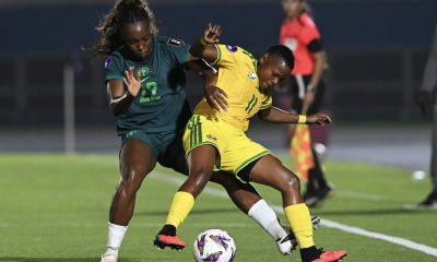 An intense on-field battle features defender Michelle Alozie representing the Nigeria women's national football team (Super Falcons) closed down by forward Thembi Kgatlana of the South Africa women's national football team (Banyana Banyana). Image used for Sportxparte news.