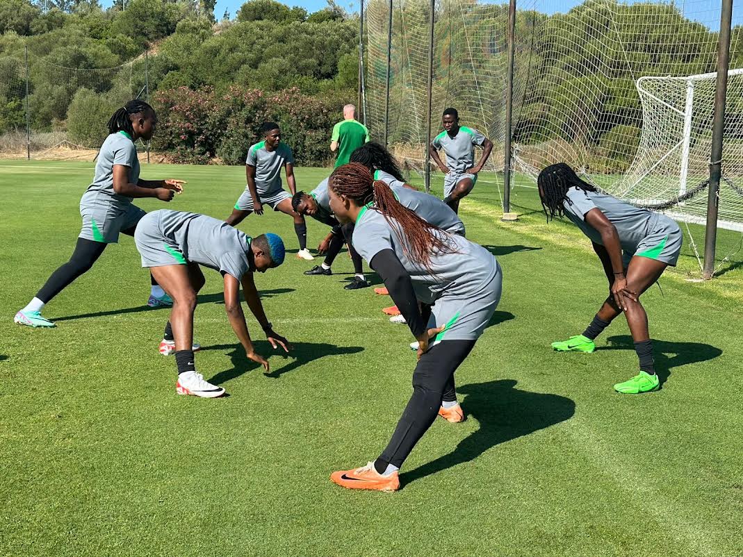 Members of Nigeria's Super Falcons soccer squad fine-tune their fitness and flexibility during an intensive outdoor training camp session ahead of a major international tournament. Image used for Sportxparte news.