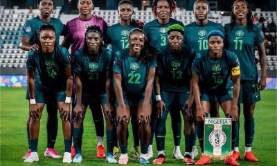 High-quality squad photo of the Nigeria Super Falcons players wearing their iconic green home kits, featuring stars like Chiamaka Nnadozie, Rasheedat Ajibade, and Michelle Alozie during the 2026 WAFCON tournament. Image used for Sportxparte news.