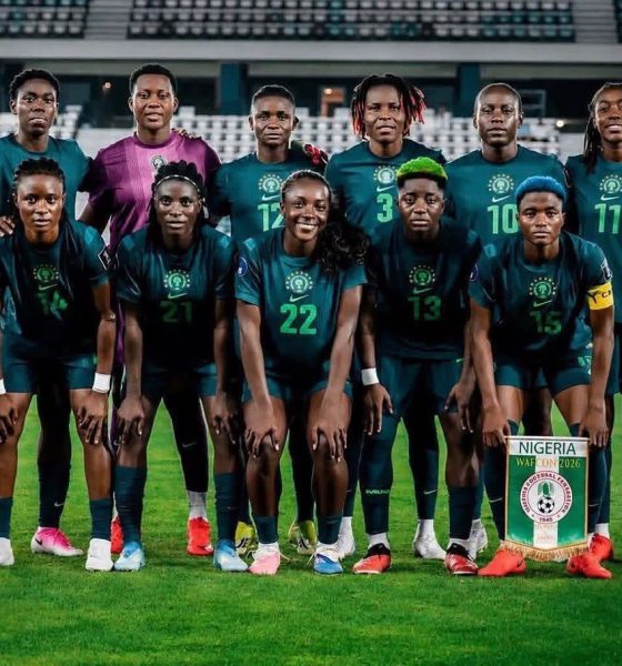 High-quality squad photo of the Nigeria Super Falcons players wearing their iconic green home kits, featuring stars like Chiamaka Nnadozie, Rasheedat Ajibade, and Michelle Alozie during the 2026 WAFCON tournament. Image used for Sportxparte news.