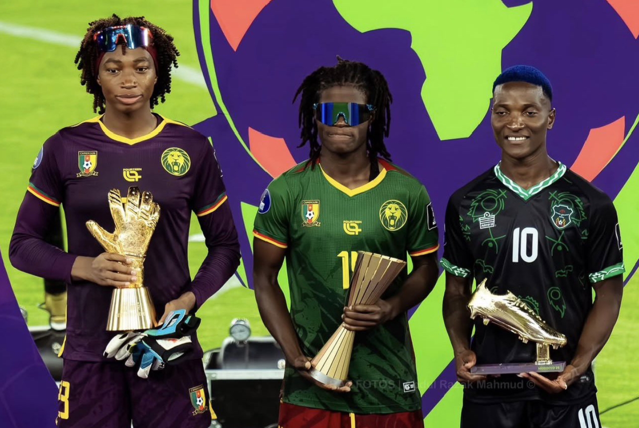 Cameroon and Benfica goalkeeper Michaely Bihina celebrates holding her Best Goalkeeper (Golden Glove) trophy after being officially named the Best Goalkeeper of the 2026 Women's Africa Cup of Nations (WAFCON) in Morocco. Image used for Sportxparte news.